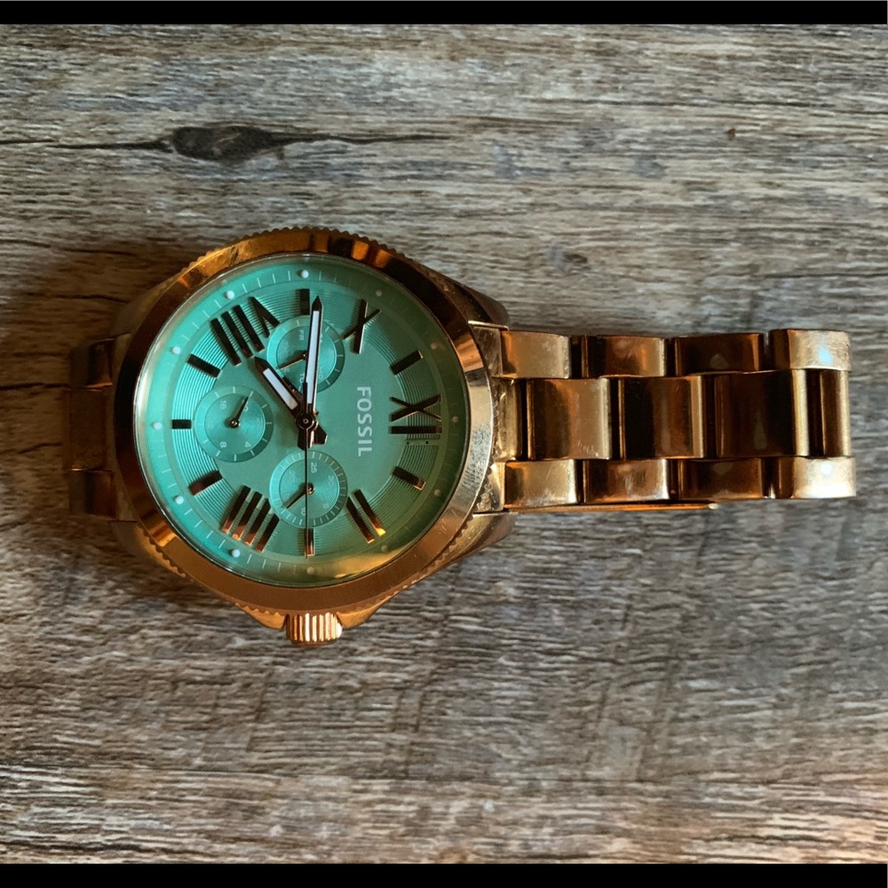 Rose gold Fossil watch with blue face